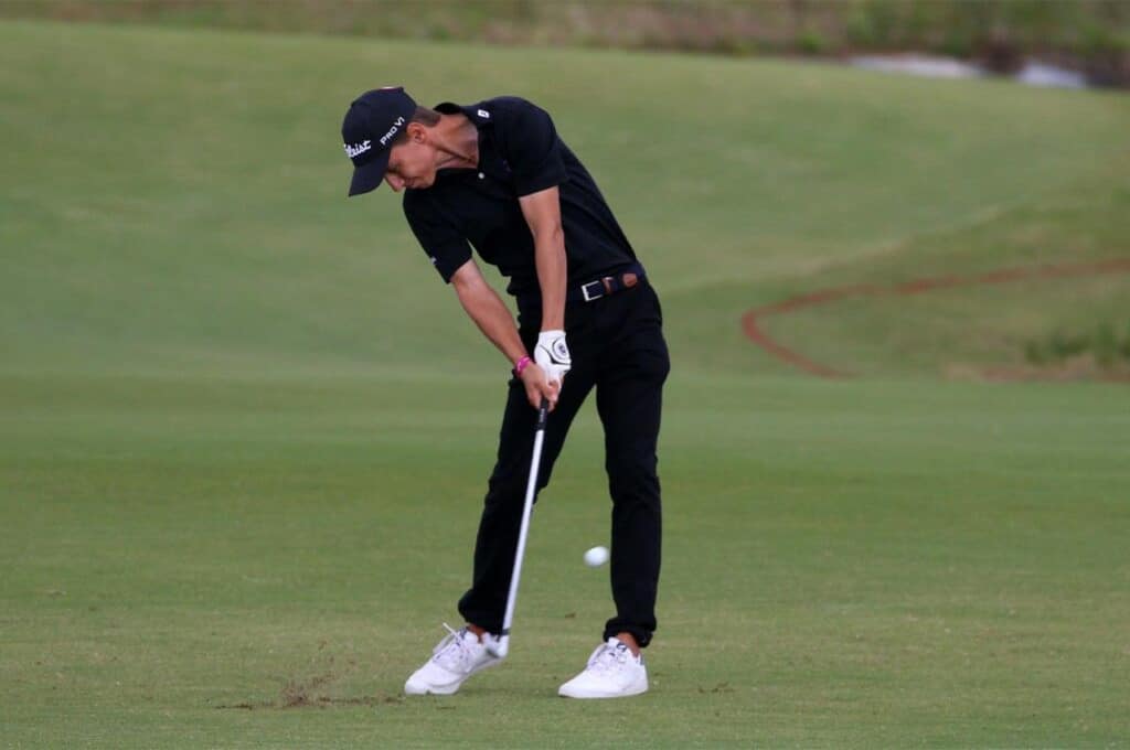 An Edge student golfer taking a shot. Tróia peninsula, Portugal. International golf college.